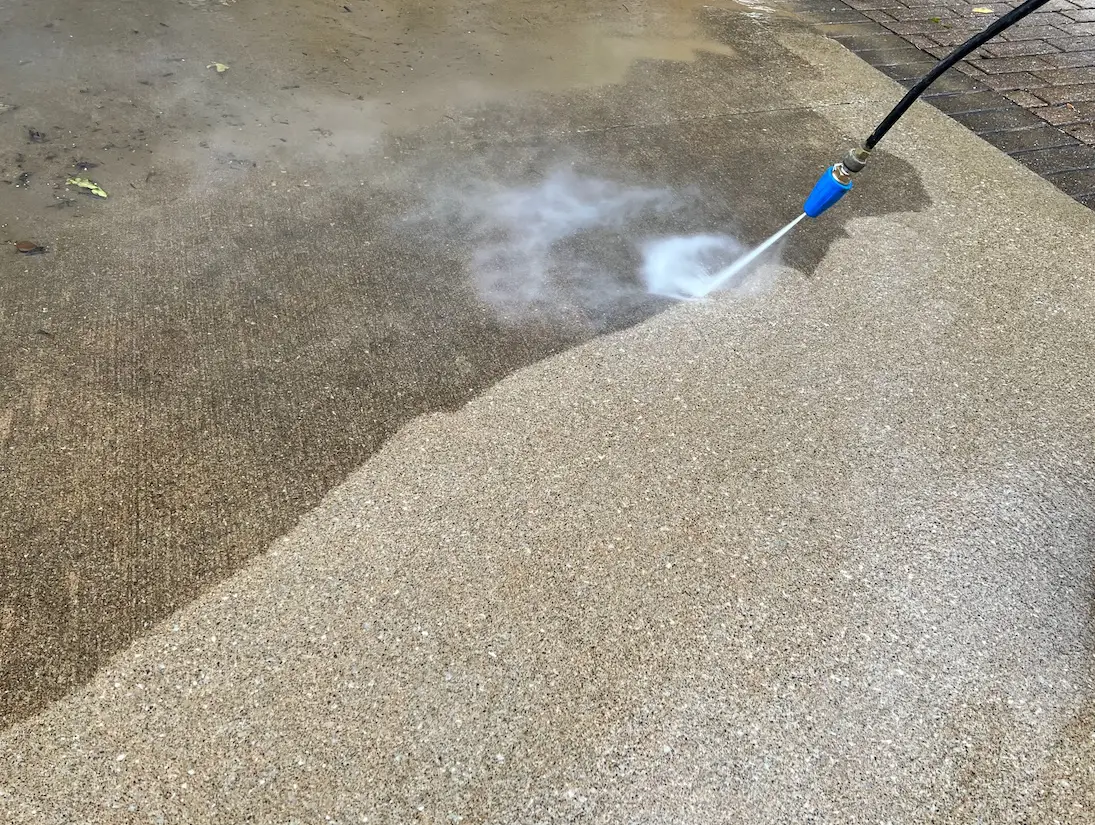 Image of concrete being pressure washed by Lance's Power Washing